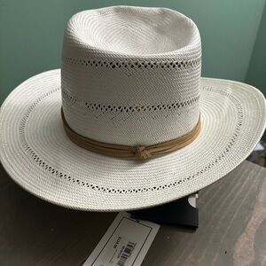 This hat has never been worn. It still has the tags attached.